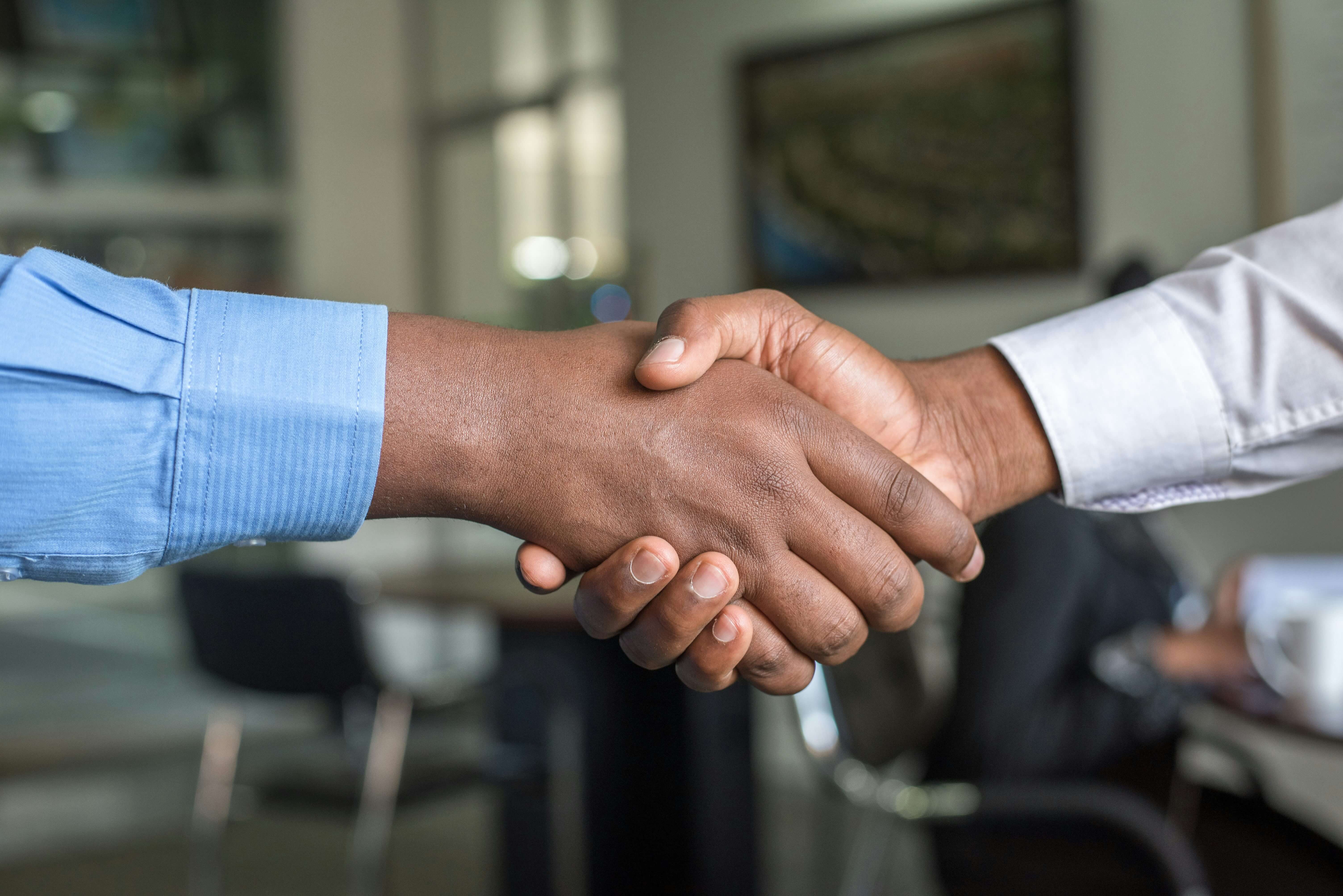 Business partnership handshake